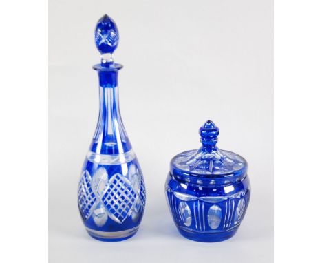 A CUT AND BLUE FLASHED GLASS TALL DECANTER, skittle shaped with a painted stopper, 15" high and a CUT AND BLUE FLASHED GLASS 