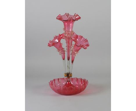 VICTORIAN CRANBERRY GLASS FOUR VASE TABLE EPERGNE, the circular dished base with frilled rim, issuing a central tall vase, en