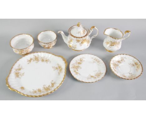 ROYAL ALBERT BONE CHINA 'ANTOINETTE' PATTERN TEA WARES, 30 pieces, with gilt floral decoration and powdered gilt wavy edges, 