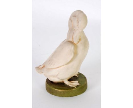ROYAL DUX PORCELAIN MODEL OF A DUCK STANDING ON A CIRCULAR BASE, 5" (12.7cm) high, raised pink triangle mark and impressed No