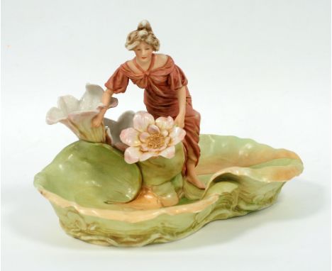 ROYAL DUX ART NOUVEAU PORCELAIN BOWL, lily pad form with a maiden seated holding two lily flowers, 12" wide, approx 8" high 