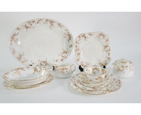 MINTON BONE CHINA 'ANCESTRAL' PATTERN DINNER AND TEA WARES, the spirally fluted borders printed with a gold trailing foliate 