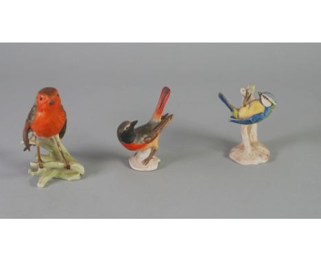 THREE GOEBEL POTTERY MODELS OF BIRDS, COMPRISING; 'Robin', 'Blue Titmouse', (CV64) and 'Redstart' 5" (12.7cm) high and smalle