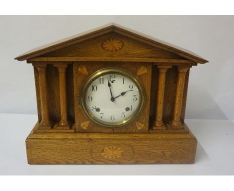 American Oak Inlaid Mantel Clock, circa late 19th century, In the Corinthian manner, Having a twin train movement, 39cm high,