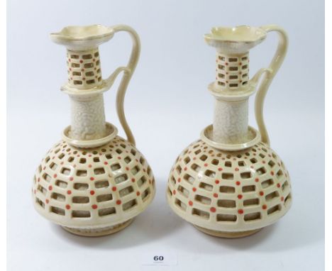A pair of Zsolnay reticulated ewers, 23cm 