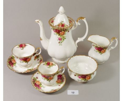 A Royal Albert 'Country Roses' tea and coffee service comprising: teapot, five bowls, two sugar bowls, two milk jugs, nine te