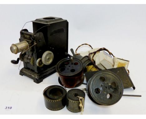 A childs magic lantern style projector and various reels of film 