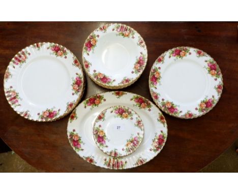 A Royal Albert 'Country Roses' dinner service comprising: meat plate, seven soup plates, six dinner plates, six breakfast pla
