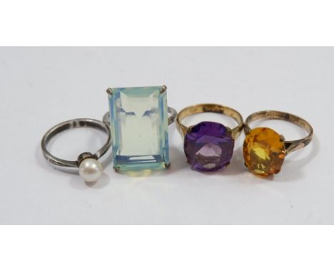 A silver pearl ring and three other dress rings (two marked 14k) 