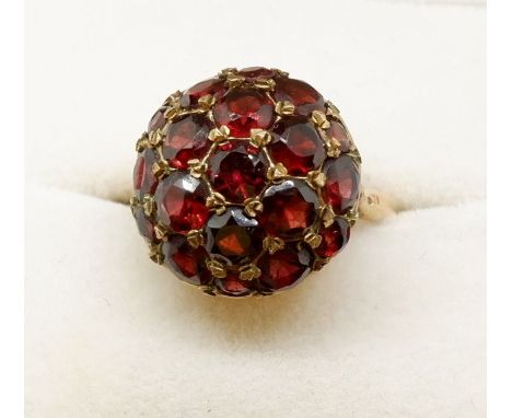 A 9 carat gold vintage dome form ring set garnets, 5g, size M to N 