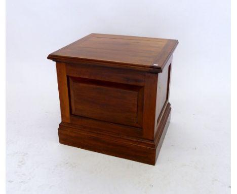 A Victorian walnut commode with rise top, inner seat and pottery liner