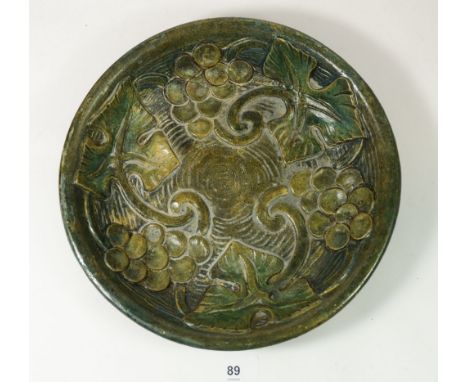 A Mary Seton Watts Compton Pottery dish with vine decoration, 27cm diameter 