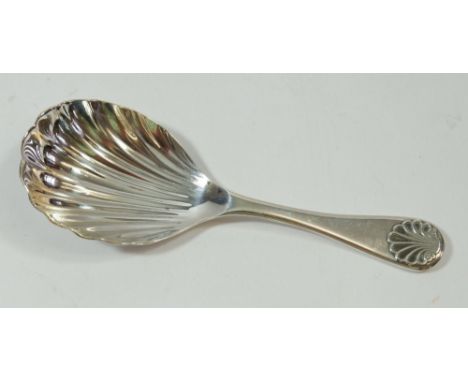 A silver caddy spoon with shell terminal, 1993 by Richards &amp; Knight 