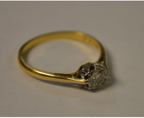 An 18ct diamond solitaire ring, illusion set