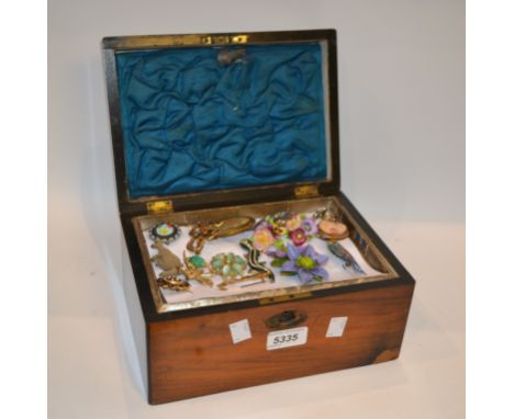 A late 19th Century jewellery box containing a quantity of vintage costume jewellery to include paste set and other brooches,