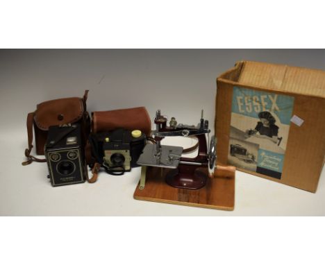 An Essex miniature sewing machine, boxed; a Kodak box Brownie camera; etc 