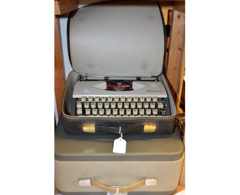 An Olympia De Luxe typewriter, cased; another similar (2)