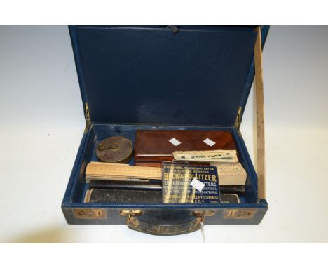 A blue leather writing case containing fountain pens, advertising blotter, rulers, map roller, etc Condition Report: Please s