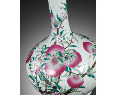 A FAMILLE ROSE 'NINE PEACHES' BOTTLE VASE, QING DYNASTYChina, 19th century. The slightly compressed globular body supported o