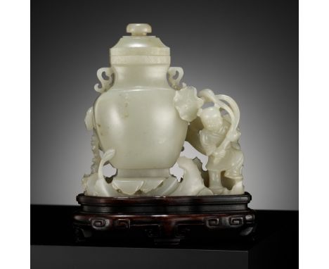 A CELADON JADE 'BOY AND CHILONG' VASE AND COVER, LATE QING TO REPUBLIC PERIODChina, 1850-1950. The baluster body is supported