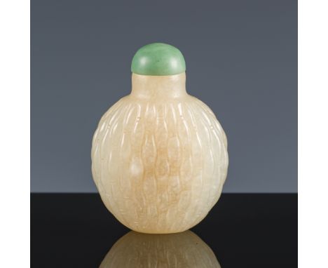 A PALE CELADON JADE 'BASKET WEAVE' SNUFF BOTTLE, MID-QING DYNASTYChina, 18th-19th century. Well hollowed, the flattened spher