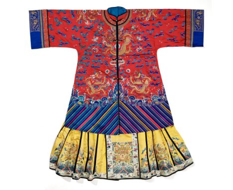 AN EMBROIDERED SILK LADY'S WEDDING ROBE AND MATCHING SKIRT, MANGAO, QING DYNASTYChina, 19th century. Finely woven in silk and