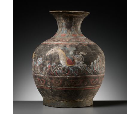 A PAINTED POTTERY 'ARCHER AND TIGER' VASE, HU, HAN DYNASTYChina, 202 BC-220 AD. The ovoid body supported on a short foot and 