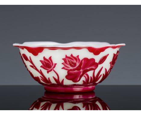 A RUBY-RED OVERLAY 'LOTUS POND' GLASS BOWL, MID-QING DYNASTYChina, 1750-1850. The deep rounded sides of the opaque milky whit