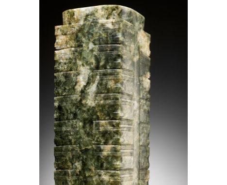 A RARE AND MASSIVE NINE-TIERED GREEN AND RUSSET JADE CONG, LIANGZHU CULTURE OR LATERExpert's note: The present piece, carved 