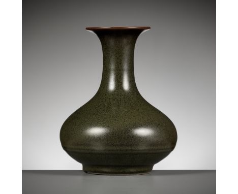 A TEADUST-GLAZED VASE, YONGZHENGChina, 1721-1735. The compressed globular body supported on a short tapered foot and rising t