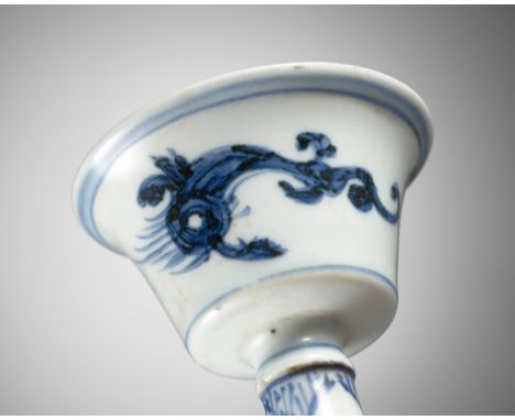 A BLUE AND WHITE 'DRAGON' STEM CUP, SECOND HALF OF THE MING DYNASTYChina, 16th-17th century. Delicately potted, the cup stand