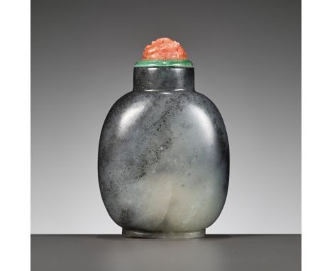 A BLACK AND WHITE JADE SNUFF BOTTLE, CHINA, 18TH CENTURYExtremely well hollowed to partial transparency, the ovoid body risin