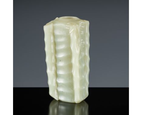 A CELADON JADE 'BAMBOO' INCENSE HOLDER, CHINA, 18TH CENTURYNaturalistically modeled as a thick hollowed bamboo segment, the r