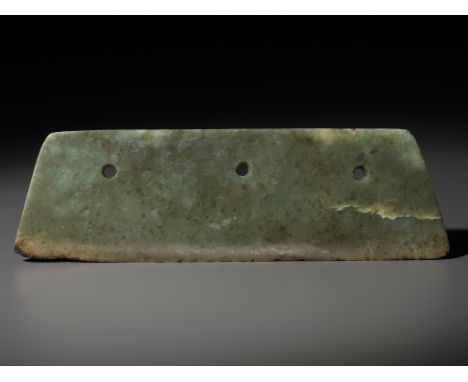 AN ARCHAIC GREEN JADE AXE BLADE, DAO, NEOLITHIC PERIODChina, c. 3000-1700 BC. Of trapezoidal form with a thin blade and bevel