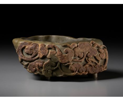 A SONGHUA STONE 'BAT AND LINGZHI' BRUSHWASHER, FIRST HALF OF THE QING DYNASTYChina, late 17th - 18th century. Supported on th