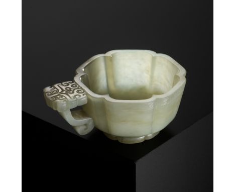 A PALE CELADON JADE WINE CUP, CHINA, 17TH-18TH CENTURYCrisply carved, of lobed form, raised on a short lobed foot, the rim ne