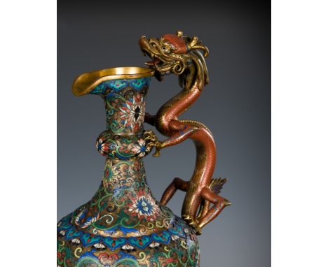 A CLOISONNE AND CHAMPLEVE 'DRAGON' EWER, LATE QING DYNASTYChina, 19th century. Neatly decorated with densely scrolling lotus 
