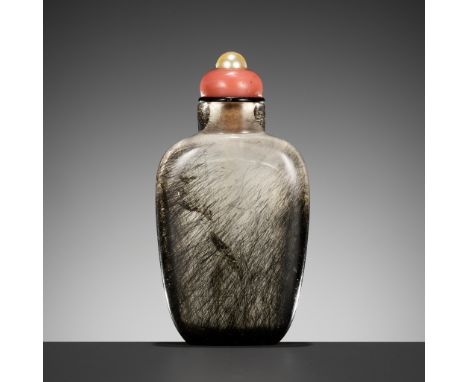 A HAIR CRYSTAL SNUFF BOTTLE, QING DYNASTYChina, 19th century. Well hollowed, the rounded rectangular body tapering to the sli