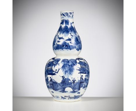 A BLUE AND WHITE DOUBLE-GOURD 'WATER TOWN' VASE, CHINA, 19TH CENTURYPainted in sophisticatedly graduated shades of cobalt blu