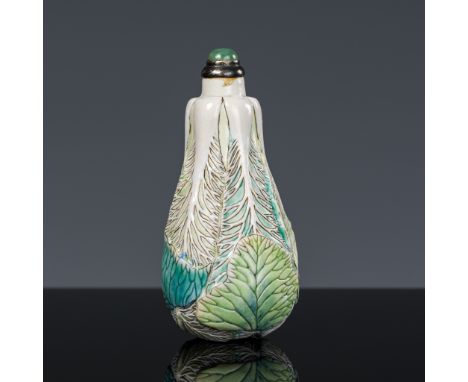 A MOLDED AND CARVED PORCELAIN 'CABBAGE' SNUFF BOTTLE, CHINA, 1850-1920Crisply molded in the form of a baicai (Chinese cabbage