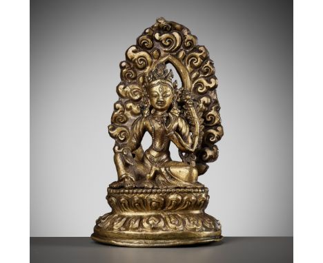 A GILT COPPER REPOUSSE FIGURE OF TARA, NEPAL, 18TH-19TH CENTURYFinely modeled seated in rajalilasana over a double lotus base