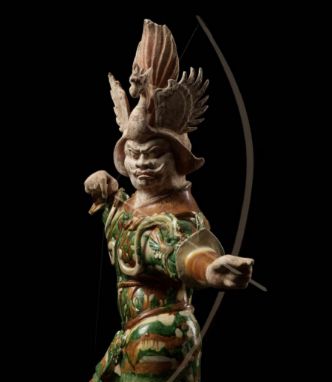 A LARGE SANCAI-GLAZED 'ARCHER' GUARDIAN FIGURE (LOKAPALA), TANG DYNASTYChina, 7th-8th century. Exquisitely modeled, standing 
