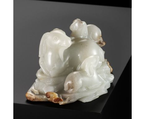 A WHITE AND RUSSET JADE 'SANYANG AND LINGZHI' GROUP, QING DYNASTYChina, 18th-19th century. Exquisitely carved with three rams