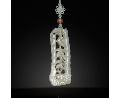 A WHITE JADE OPENWORK 'BAMBOO' PENDANT, 19th CENTURYChina. Finely carved as two leafy bamboo stalks, suspended with a silk st