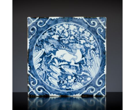 A BLUE AND WHITE 'QILIN' TILE, LATE MING DYNASTYChina, 16th - 17th century. Heavily potted and finely painted in well graduat