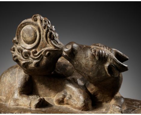 A LIMESTONE FIGURE OF A TWO-HORNED MYTHICAL BEAST, GAZING AT THE MOON, TANG DYNASTYExpert's note: The pose of this mythical b