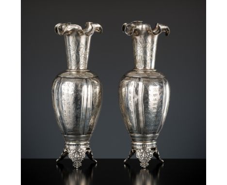 A PAIR OF REPOUSSE SILVER VASES, YANGQINGHE MARK, LATE QING TO REPUBLIC PERIODChina, c. 1850-1935. Each with a baluster body 