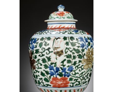 A WUCAI 'THREE BOYS' JAR AND COVER, SHUNZHI PERIODChina, 1644-1661. Of ovoid form, the body decorated in bright enamels of re