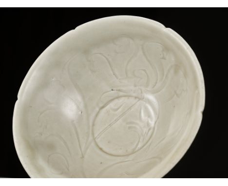 A LARGE LOBED QINGBAI GLAZED PORCELAIN BOWL, SONG DYNASTYChina, 960-1279. Of conical form supported on a short straight foot 