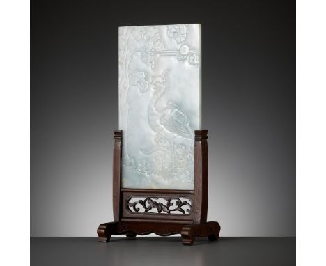 A WHITE AND EMERALD-GREEN JADEITE 'PHOENIX' TABLE SCREEN, CHINA, 19TH CENTURYOf rectangular form, carved in low relief to one